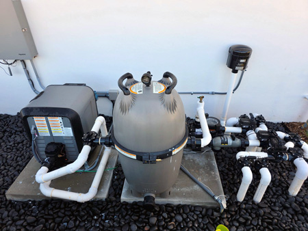 A licensed professional repairs hot tub equipment.